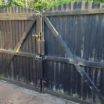 Driveway gates prior to being cleaned and repainted