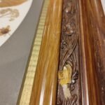 Ornate picture frame showing damage